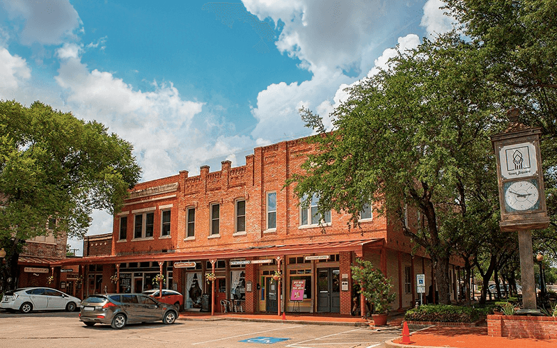 Historic Town Square in Lancaster, Texas, with vintage buildings and brick streets, promoting sell junk cars in Lancaster, Texas