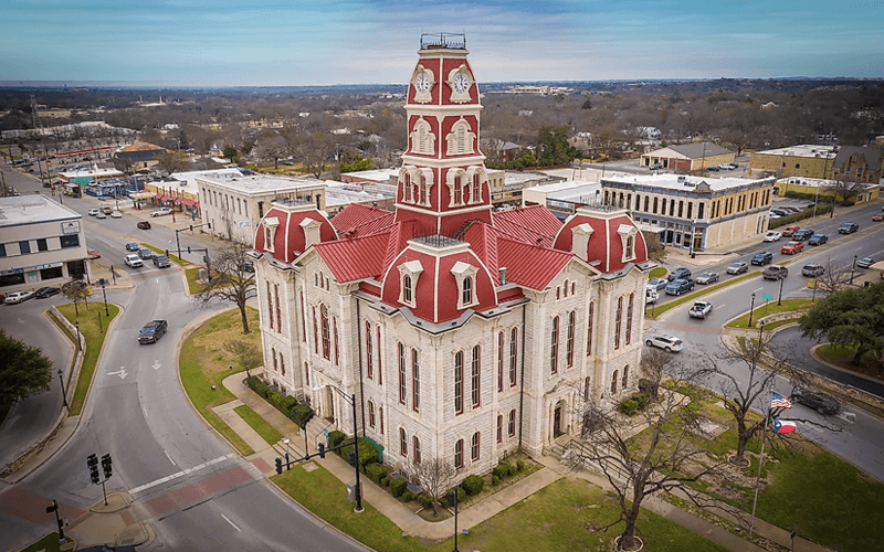 Aerial view of the Parker County Courthouse in Weatherford, TX, promoting our services, we buy junk cars in Weatherford.