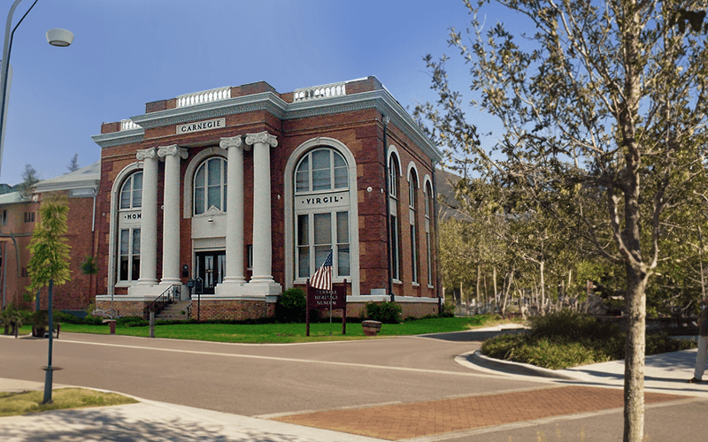 Terrell Heritage Museum with an AI-edited street, promoting cash for cars in Terrell, Texas